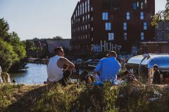 Guys Chilling By The Canal